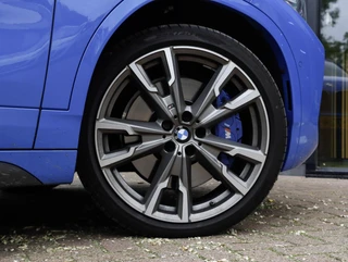 BMW X2 M35i High Executive Panoramadak | Harman Kardon | Sportstoelen | Misano Blue / 34
