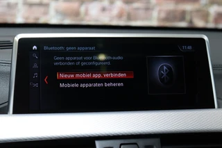 BMW X1 sDrive18i High Executive M Sport Pakket Automaat  / Navigatiesysteem Professional / Panoramadak / 18 Inch / LED / Stoelverwarming / Achteruitrijcamera / Extra Getint Glas / Harman Kardon / Shadow Line / Parkeersensoren voor+achter / 20