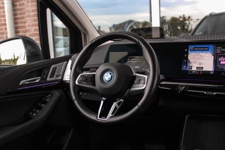 BMW 2-serie Active Tourer 230e xDrive Luxury Line | 1e eigenaar | BTW auto | Driving Assistant | Harman Kardon | 360 camera | Panoramadak | Head-up | M-sportstuur | Keyless entry / 21