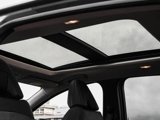 Nissan Ariya Evolve 91 kWh | SOH 99% | Panoramadak | Trekhaak | ACC | HUD | Voorstoelen verwarmd en geventileerd | Warmtepomp | 360 Camera | 19" / 15