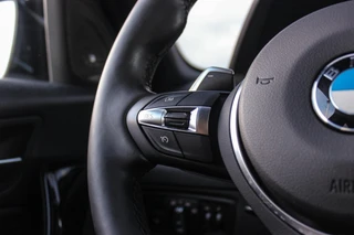BMW 1-serie 120i Edition M Sport Shadow High Executive | 2e eigenaar | Driving Assistant | Schuif-/kanteldak | Camera | Harman Kardon | Keyless entry | LED | M sport remmen | PDC / 21
