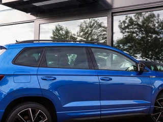 Skoda Karoq 1.5 TSI Sportline 150PK DSG Camera ACC Navi Stoel/Stuurverw. Race Blue 19 inch / 13