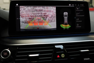 BMW 5 Serie Touring 530e High Executive M Sport Pakket Automaat  / Live Cockpit Professional / SOH 87% / Panoramadak / Trekhaak / Driving Assistant Professional / Comfortstoelen / Laserlight / Head-Up Display / Adaptief Onderstel / DAB / Parking Assistant / Hifi / 31