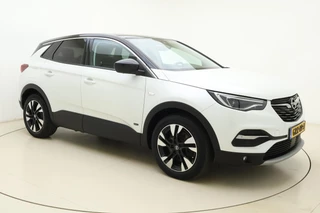 Opel Grandland X 1.6 Turbo 300pk Hybrid4 Elegance | Navigatie | Keyless | Camera | Parelmoer kleur | Electrische achterklep | Lichtmetalen velgen | AGR Comfortstoelen | Voorruitverwarming | Zwart dak / 9