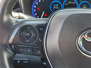Toyota Corolla Touring Sports 1.8 Hybrid Style TREKHAAK BLIND SPOT STOEL/STUURVERW PARK-SENSOREN HEAD-UP EL-ACHTERKLEP APPLE/ANDROID 16'' LM-VELGEN AD-CRUISE CLIMA / 17