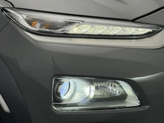 Hyundai Kona EV Premium 64 kWh SOH 90,1% Warmtepomp | Leer | Head-Up | Elektr. Stoelen | Adaptive Cruise / 16