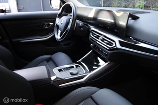 BMW 3-serie Touring 320e xDrive/Led/Trekhaak/Navi/Tel/All seas/ / 28