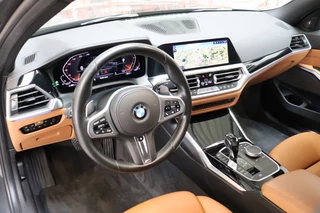 BMW 3 Serie Sedan 318i High Executive Luxury Line Automaat  / Live Cockpit Professional / Trekhaak / Stoelverwarming voor+achter / Achteruitrijcamera / Harman Kardon / Stuurverwarming / LED / Ambiance Verlichting / DAB / Sportstoelen / 13