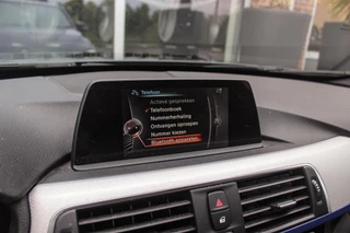 BMW 3-serie Touring 318i Centennial Executive M-sport | 2e eigenaar | HiFi audio | Navigatie | Bluetooth | Climate control | M-sportstuur | Cruise control | PDC | 18 inch | Trekhaak / 25
