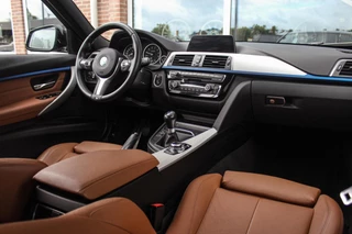 BMW 3-serie Touring 318i Centennial Executive M-sport | 2e eigenaar | HiFi audio | Navigatie | Bluetooth | Climate control | M-sportstuur | Cruise control | PDC | 18 inch | Trekhaak / 12